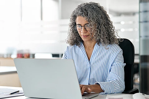 woman-working-on-odessa-asset-finance-platform An asset finance professional working on a laptop considering adding as-a-service offerings.